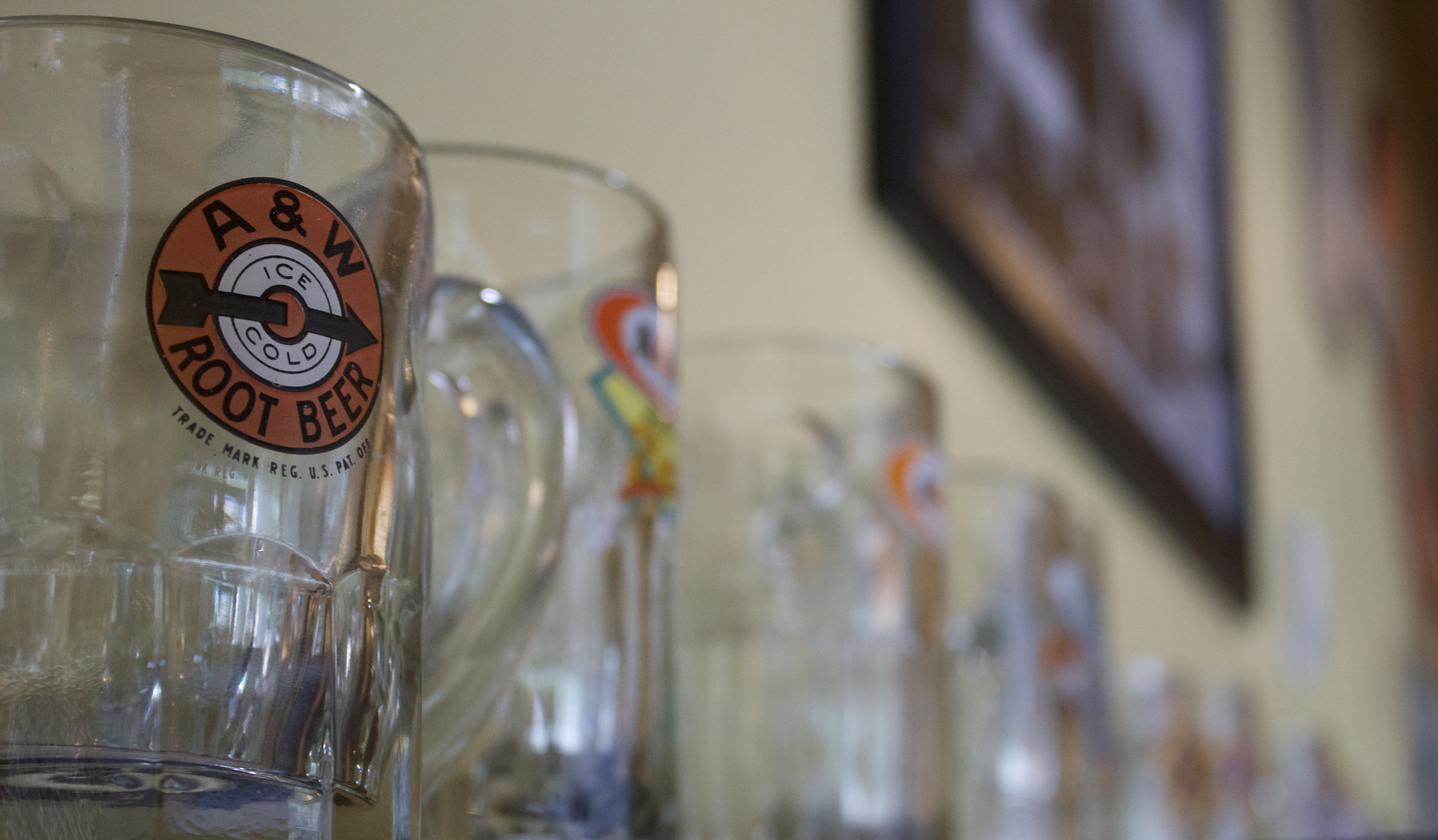 A&W Mugs on a shelf with one mug in focus